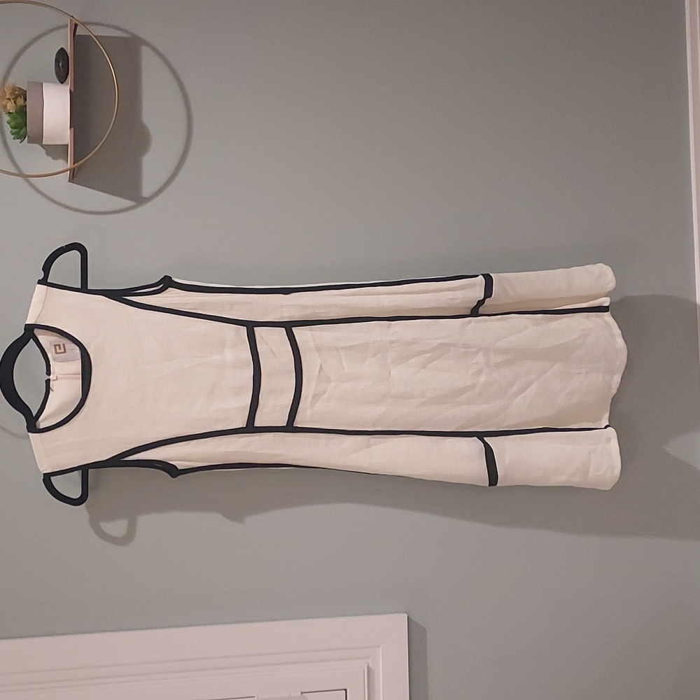 Cream dress with black piping. Brand:Edit Size: XS